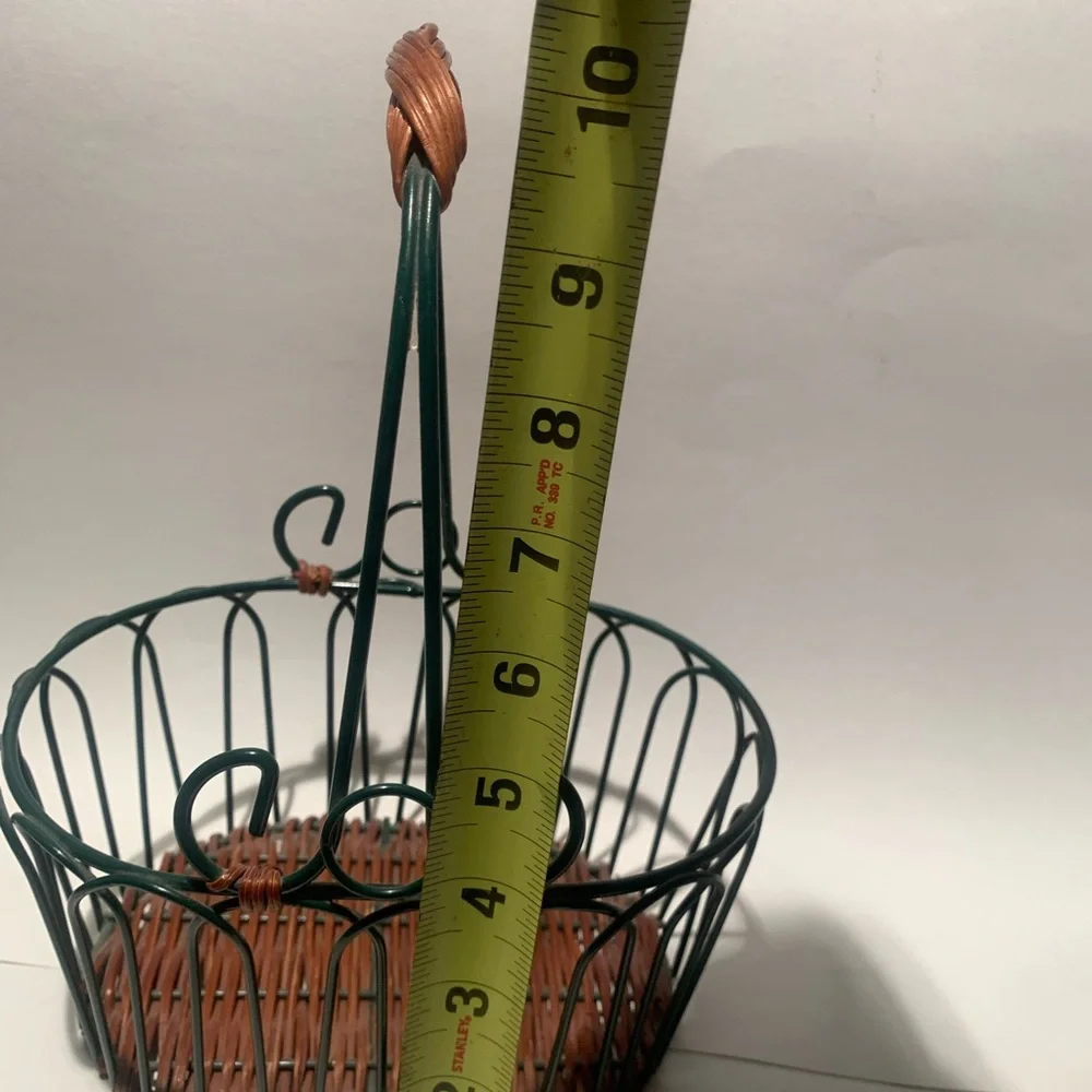 Green wire basket with brown woven bottom